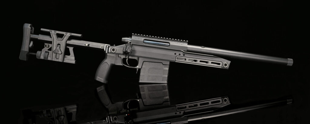 A detailed view of a tactical firearm, showcasing its precision mechanics, adjustable buttstock, ergonomic grip, rail system, and barrel, labeled 'TAC-41'. The firearm is set against a reflective dark background.